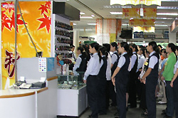 Photograph of a staff briefing at a Japanese invested store in China